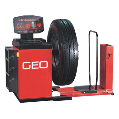 A red and black Geo tyre balancer with a commercial vehicle tyre mounted on a spindle, shown against a plain white background.