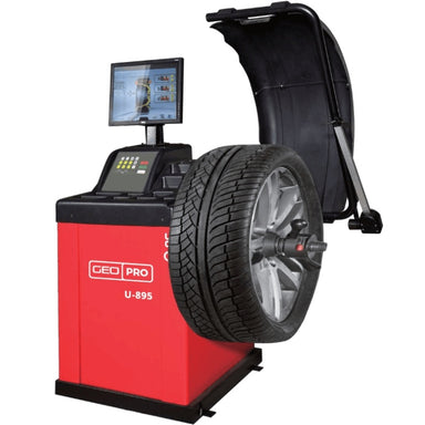 A red and black Geo Pro U-895 wheel balancer with a mounted tire, shown on a plain white background, front side view