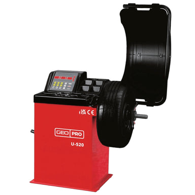 A red and black professional tyre balancer, model U-520 by GEO, with a digital control screen and a tyre mounted on a wheel hub, shown against a plain white background.