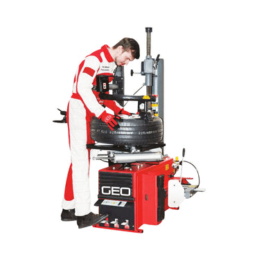 Person working on a tire with a GEO tire changer on a white background